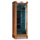 VITRINA REFRIGERADA PARA VINOS - Mod. ENY 420 N NM - ESTÁTICO - TEMPERATURA °C +4/+18 - N. 1 PUERTA ACRISTALADA - ESTRUCTURA EN MADERA COLOR NOGAL - CAPACIDAD LORDA Lt. 382 - ALIMENTACIÓN 220/50Hz MONOFÁSICA - Medidas cm L 65,5 x P 63,5 x H 188